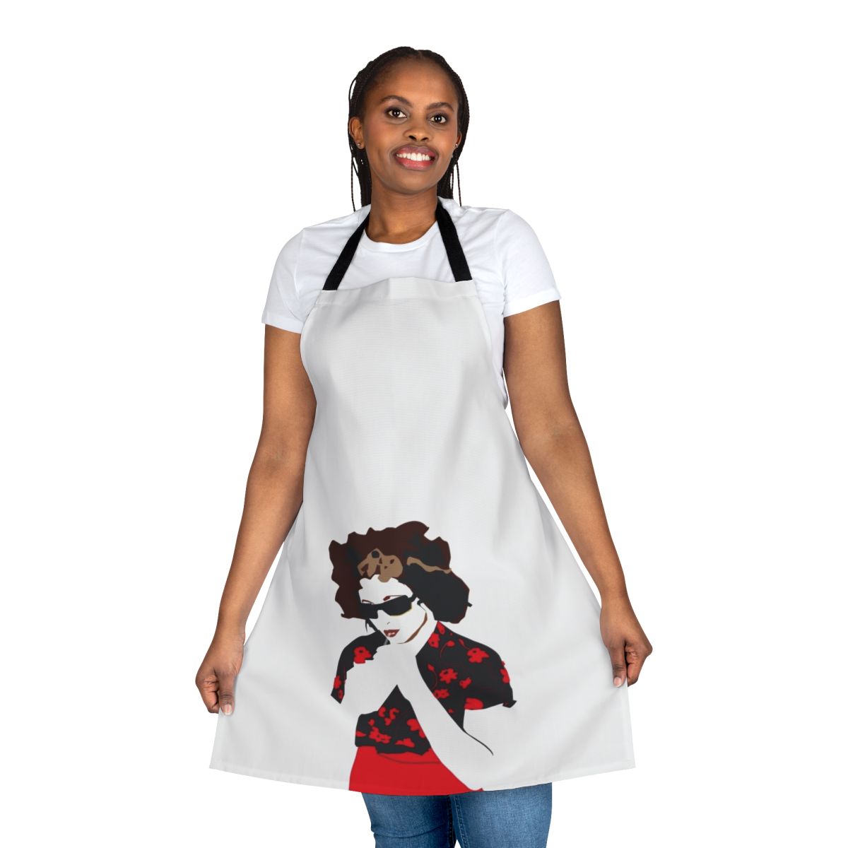 A vibrant red apron featuring a bold flower design, inspired by the music of artist Goldfrapp.