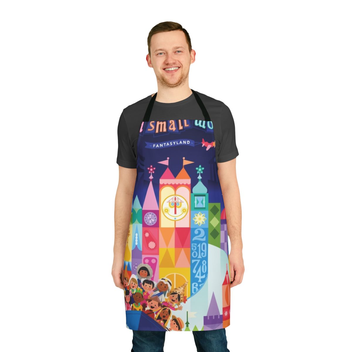Colorful illustrated apron featuring a fantasy world with boats, cities, and whimsical elements.
