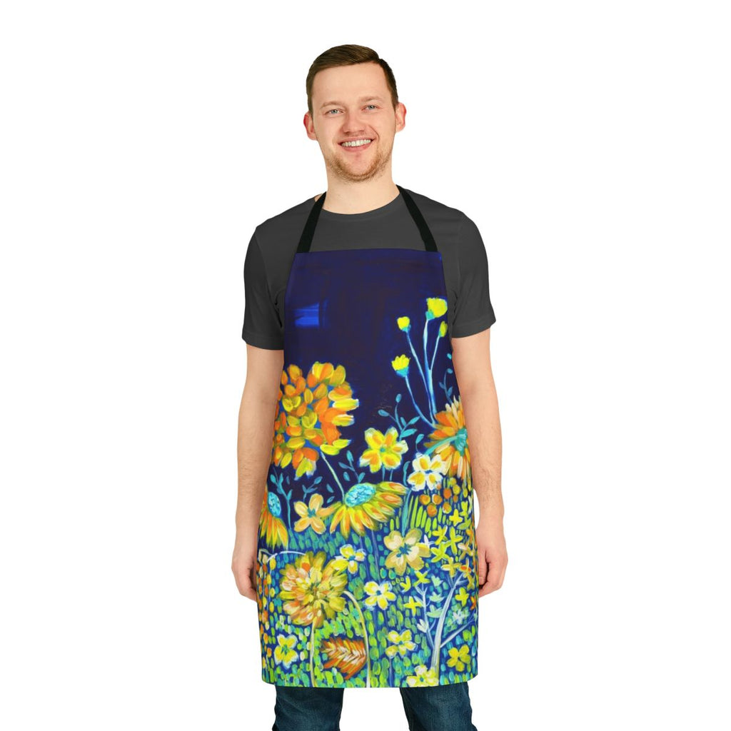 A colorful floral apron in shades of blue, yellow, and white featuring daisies and other botanical designs.
