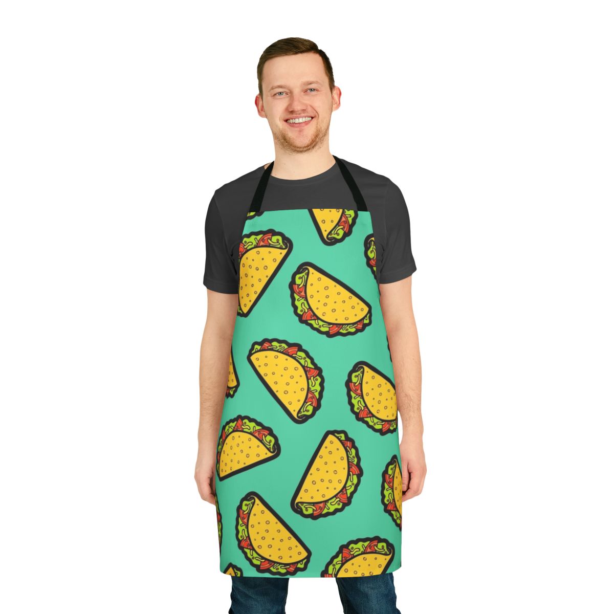 Colorful and whimsical apron featuring a repeating taco pattern in shades of red, green, blue, and yellow.