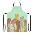 Colorful apron featuring a pattern of diverse hands and fists, symbolizing unity and community.