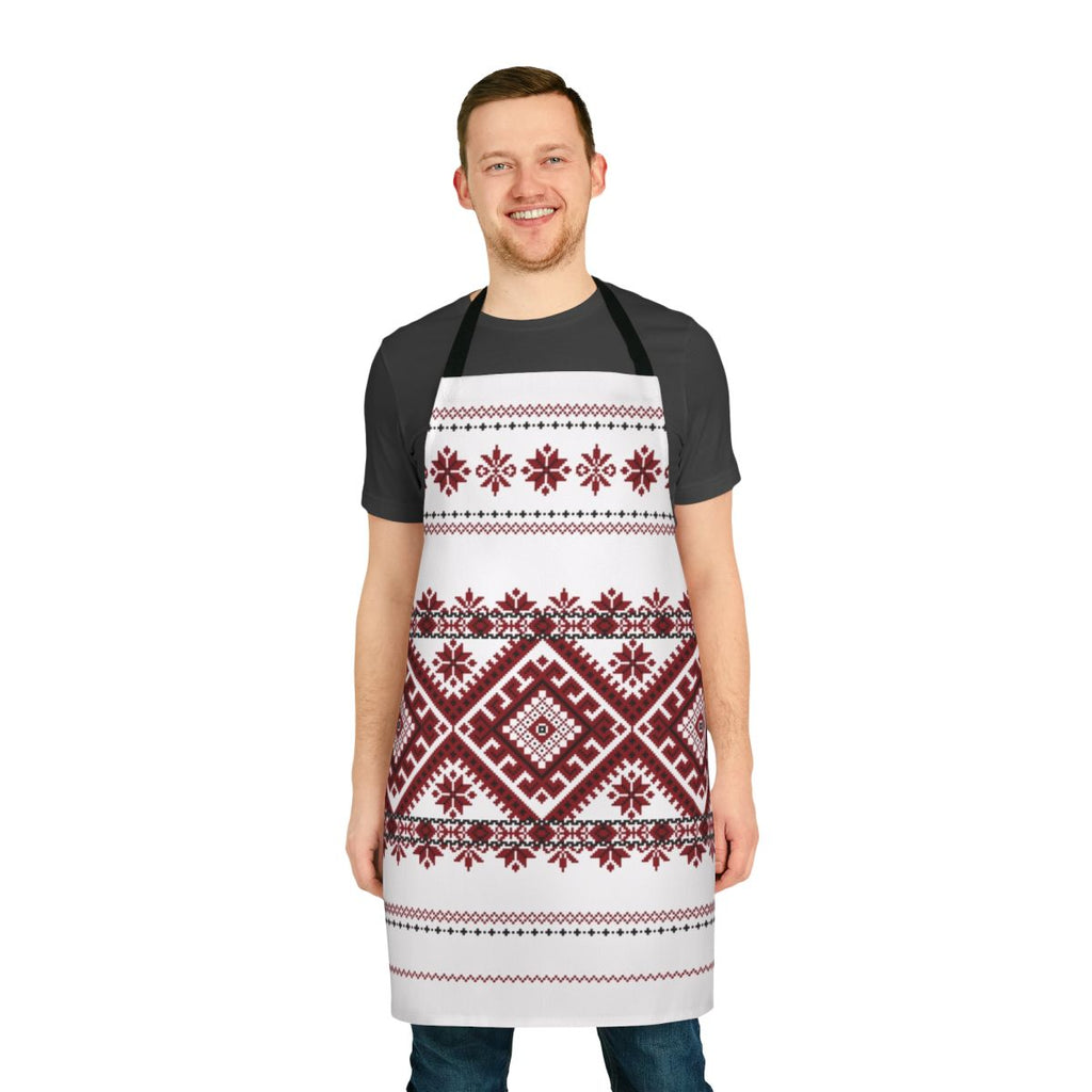 A traditional Romanian-inspired apron featuring a bold geometric motif in red and black.