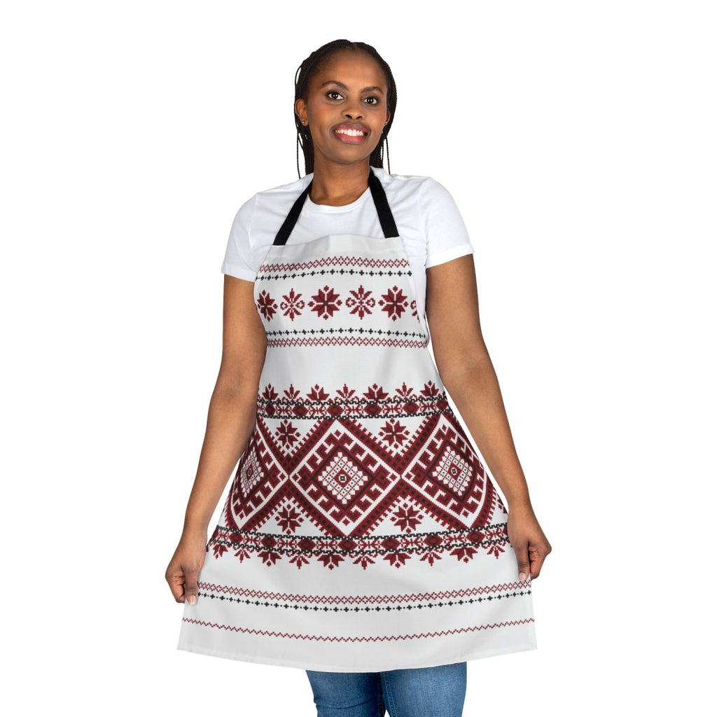 A traditional Romanian-inspired apron featuring a bold geometric motif in red and black.