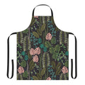 Lush, tropical-inspired apron featuring monstera leaves, palm fronds, and a blend of green, pink, and black