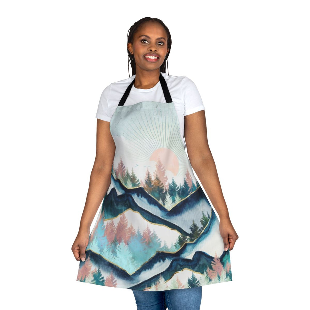 Colorful watercolor painting of a snowy winter forest landscape, featuring trees, mountains, and birds on a nature-inspired apron.