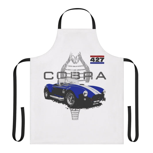 Vintage car enthusiast wearing a retro-styled apron with an AC Cobra graphic