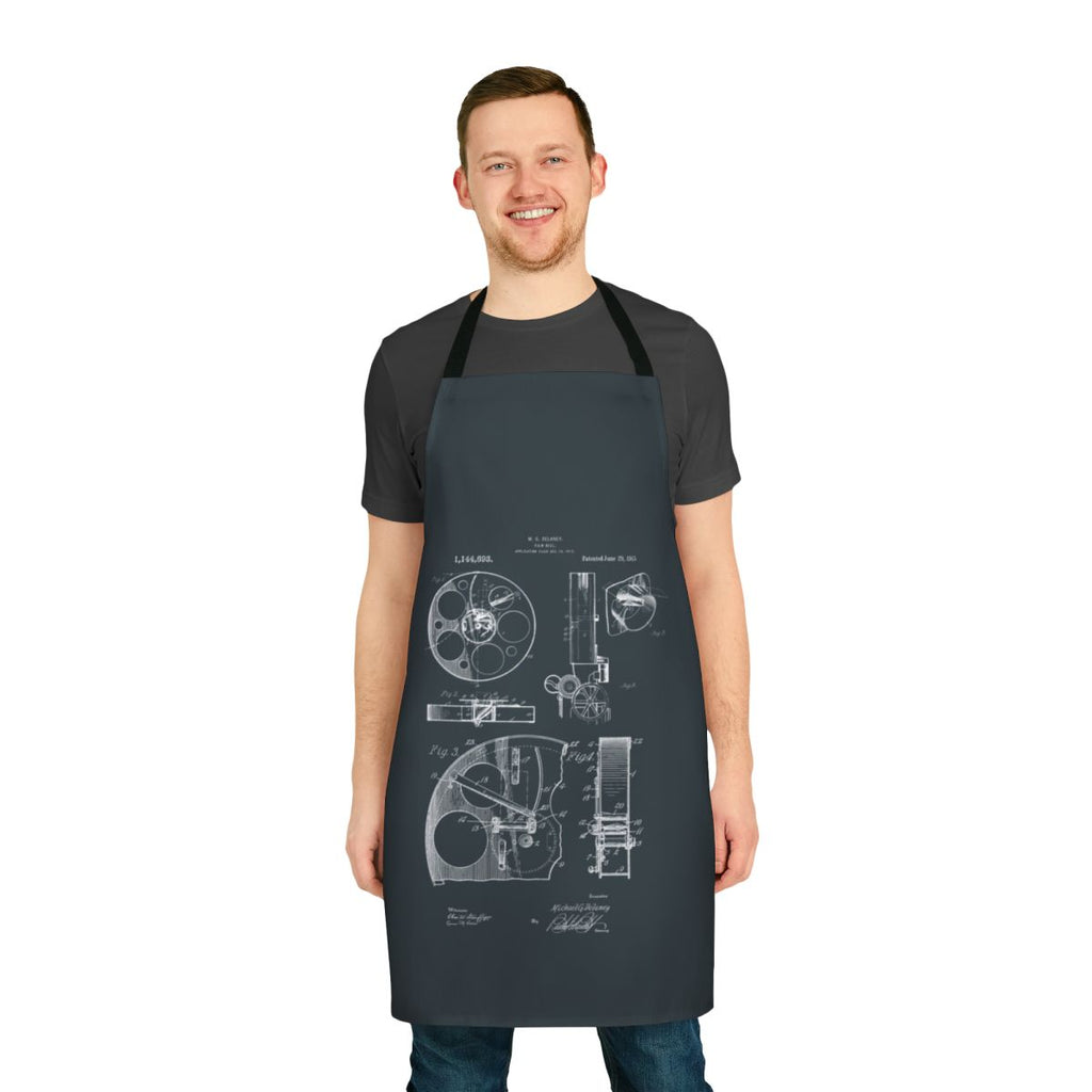 A vintage-inspired apron featuring patent drawings of a 1915 film reel camera.