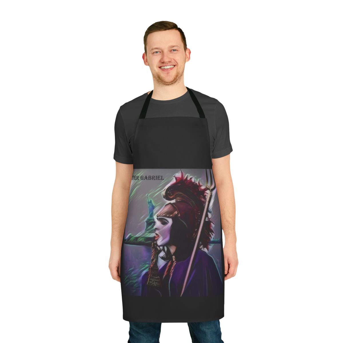 Genesis Britannia Apron featuring a vintage-style design with the Statue of Liberty and references to the early progressive rock band Genesis.