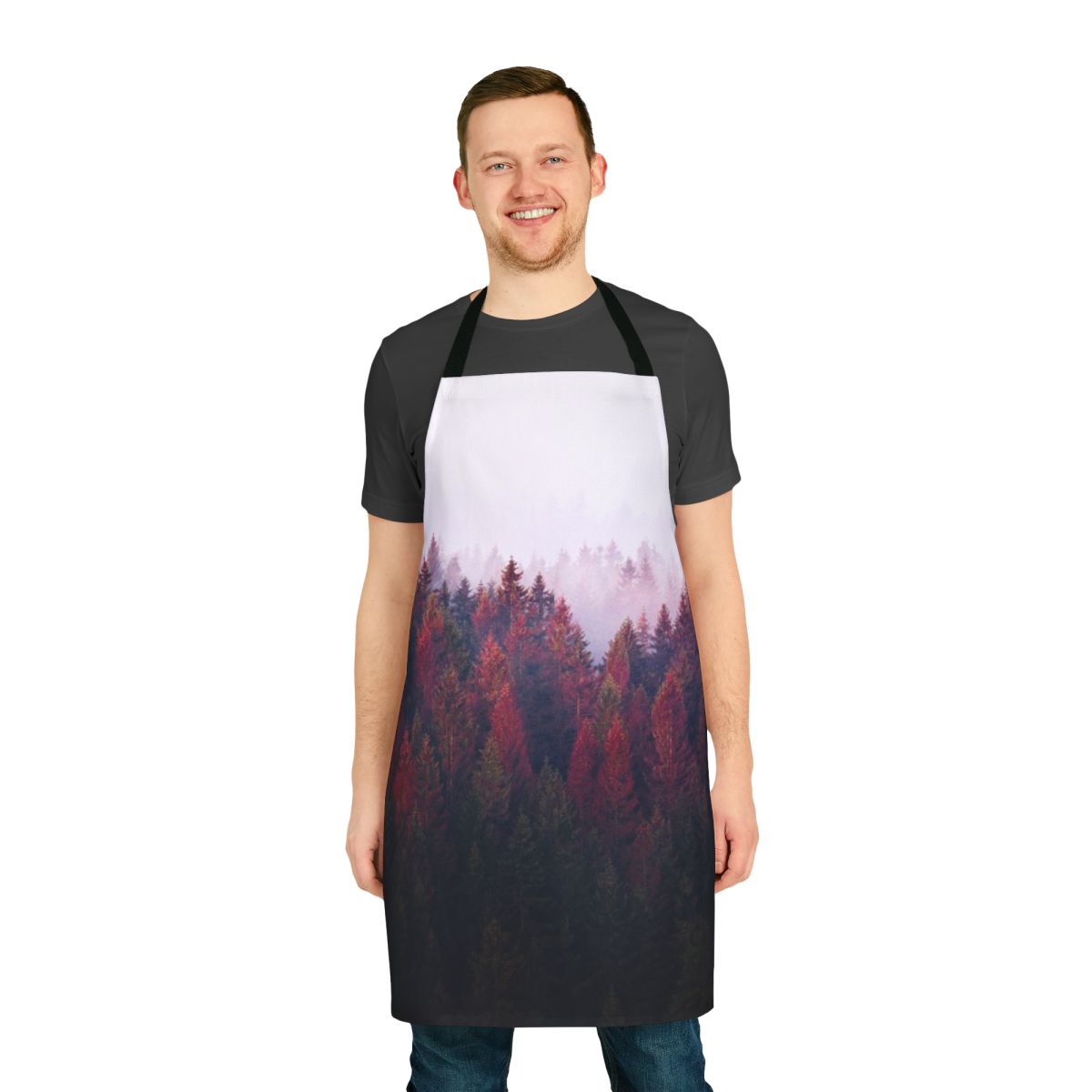 A vintage-style apron featuring a serene nature landscape with trees, fog, and mountains