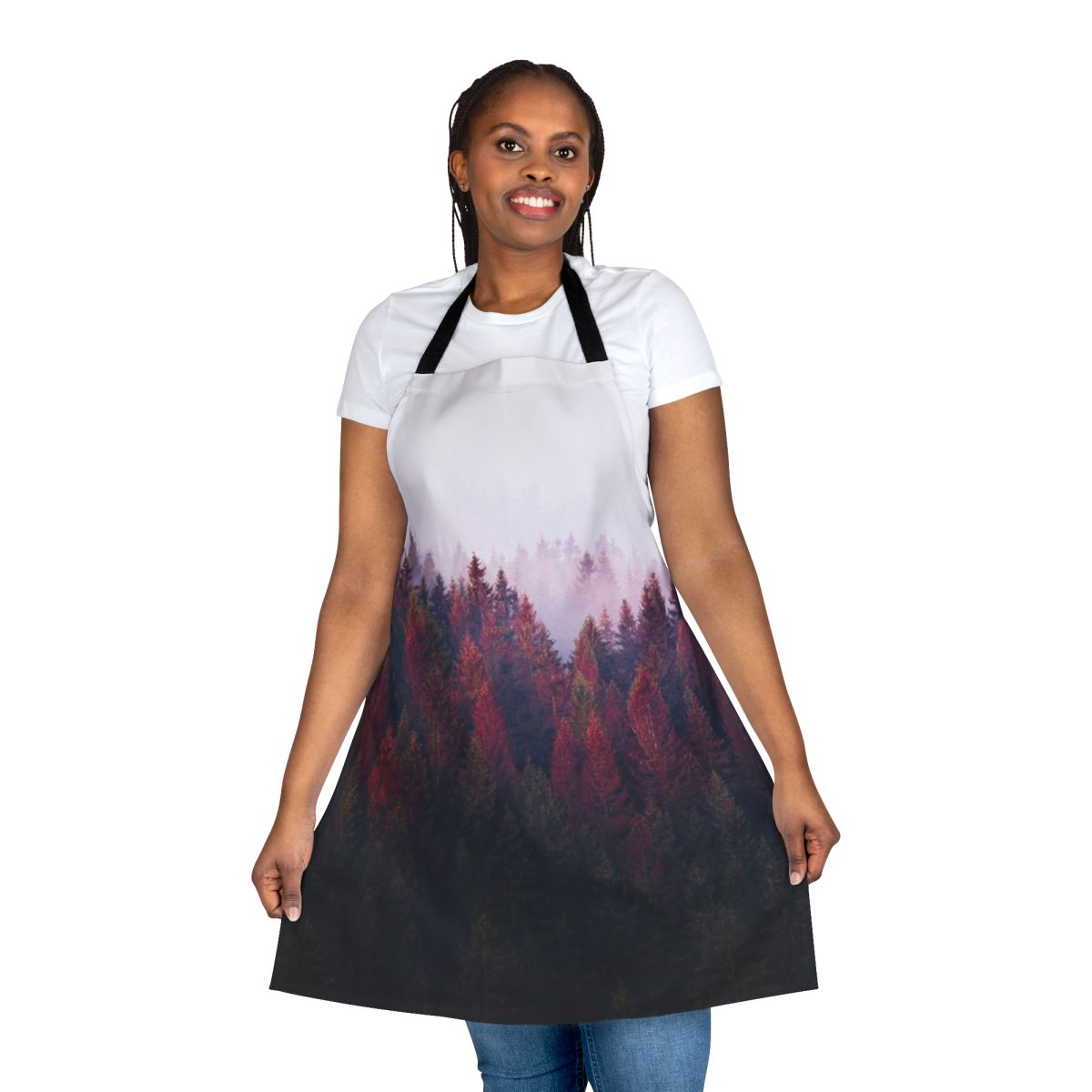 A vintage-style apron featuring a serene nature landscape with trees, fog, and mountains