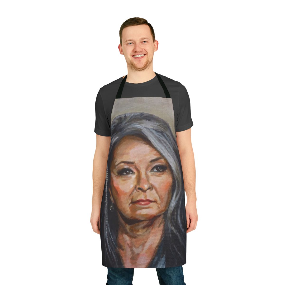 A vintage-inspired apron featuring a portrait of a mature woman with grey hair and a thoughtful gaze, perfect for the kitchen or as a gift.