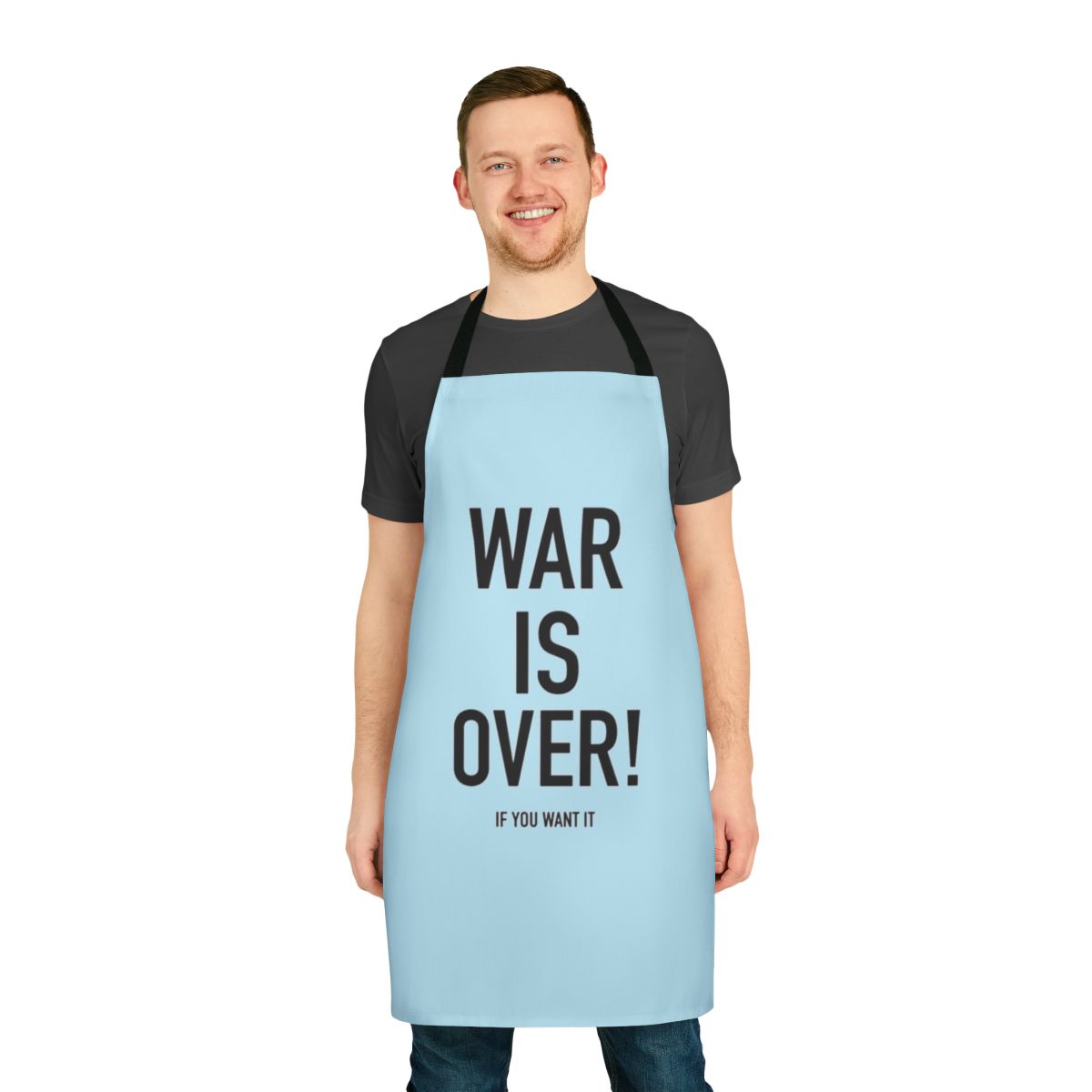 "Vintage-inspired 'War Is Over' apron featuring Yoko Ono and John Lennon's iconic imagery"