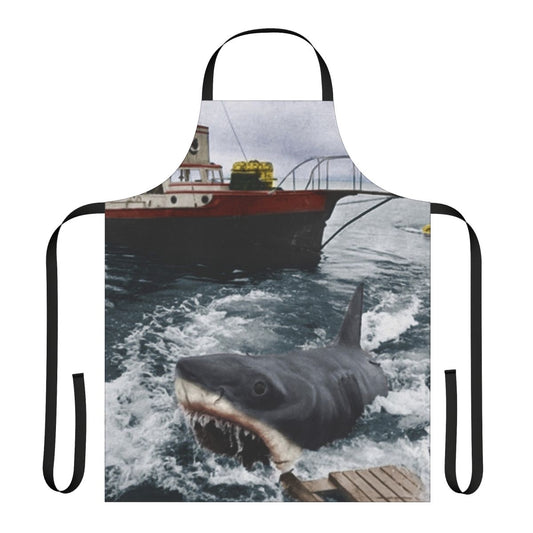 A vintage-style apron featuring the iconic Jaws movie poster design, perfect for photography, cooking, and baking enthusiasts.