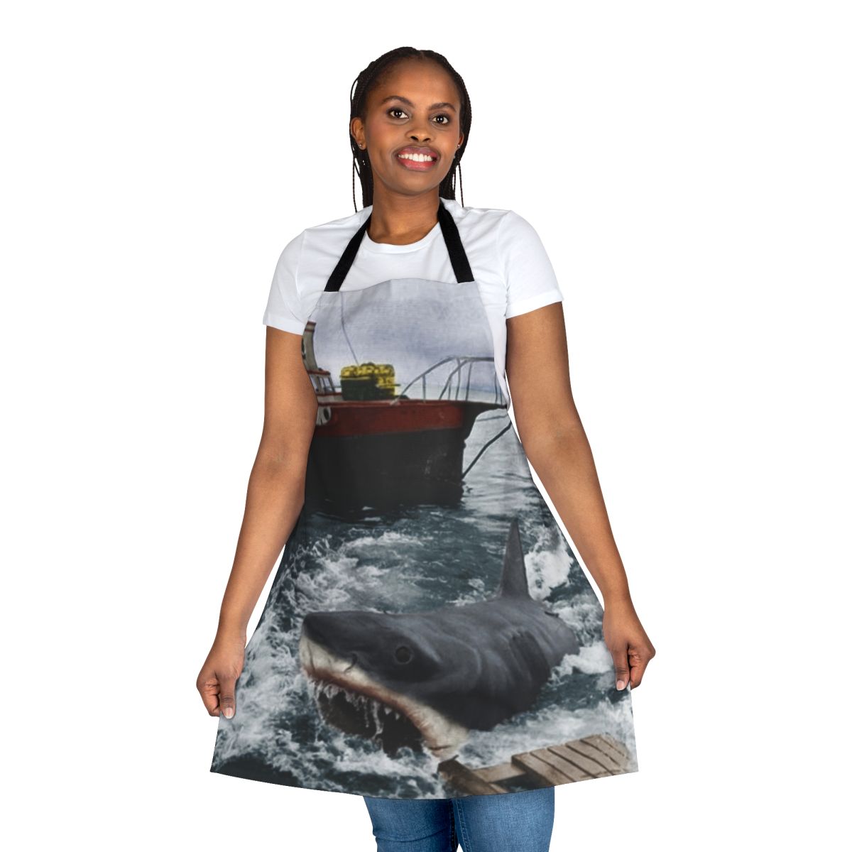 A vintage-style apron featuring the iconic Jaws movie poster design, perfect for photography, cooking, and baking enthusiasts.