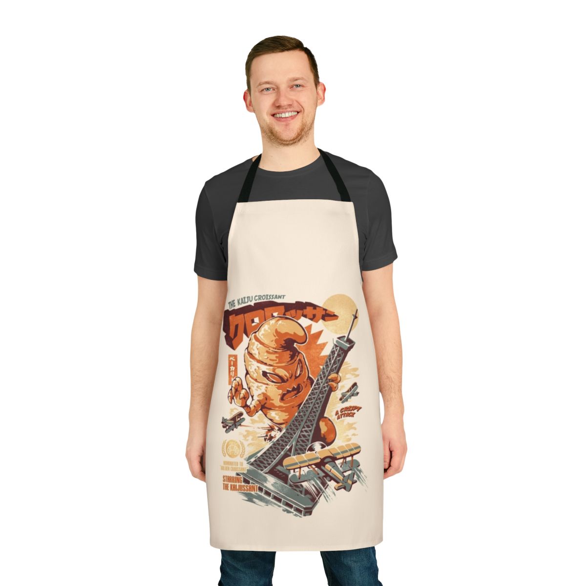 Vintage-style apron featuring a whimsical kaiju monster design, perfect for the retro bakery or horror movie fan.