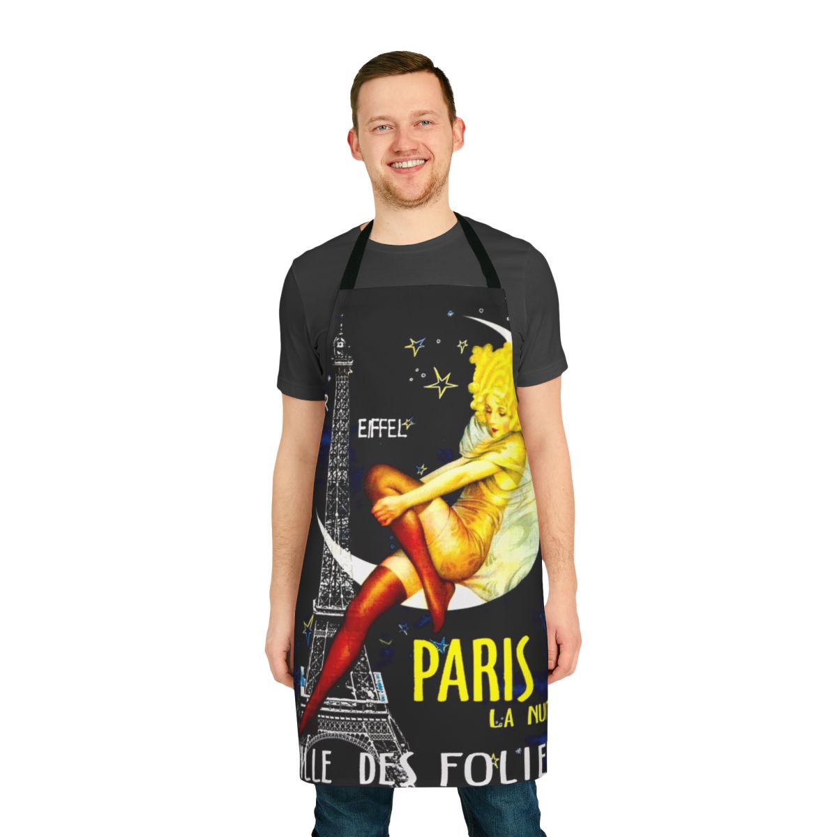 Vintage-inspired apron featuring a colorful Paris Follies travel print design with the Eiffel Tower, pinup elements, and whimsical details.