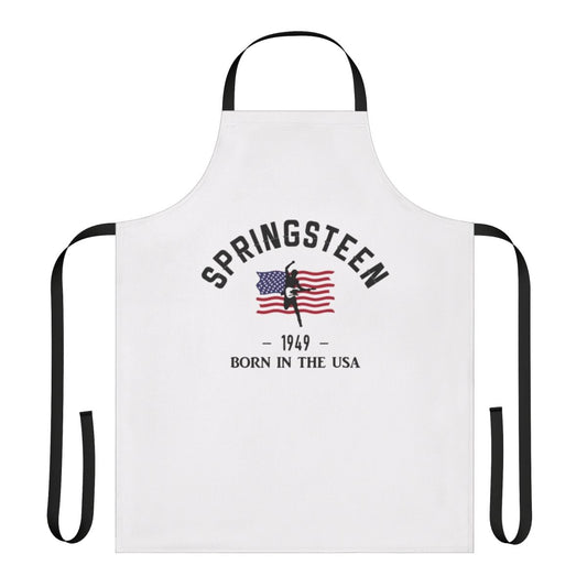 Vintage rock-inspired apron featuring the lyrics and imagery of Bruce Springsteen's iconic album "Born in the U.S.A."
