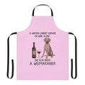 Weimaraner dog wearing an apron with the text "Weimaraner and Wine" on it