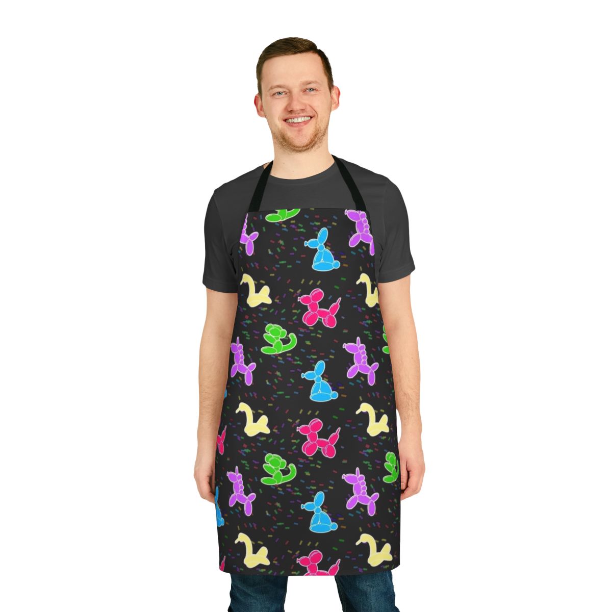 Colorful balloon animals printed on a black cooking apron
