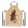 Whimsical and vintage-inspired illustration of a brown bear wearing a bowler hat and riding a bicycle, printed on a high-quality apron.