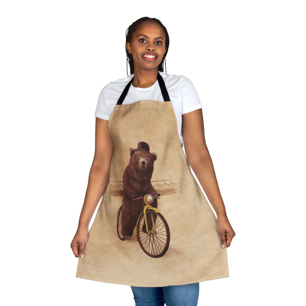 Whimsical and vintage-inspired illustration of a brown bear wearing a bowler hat and riding a bicycle, printed on a high-quality apron.