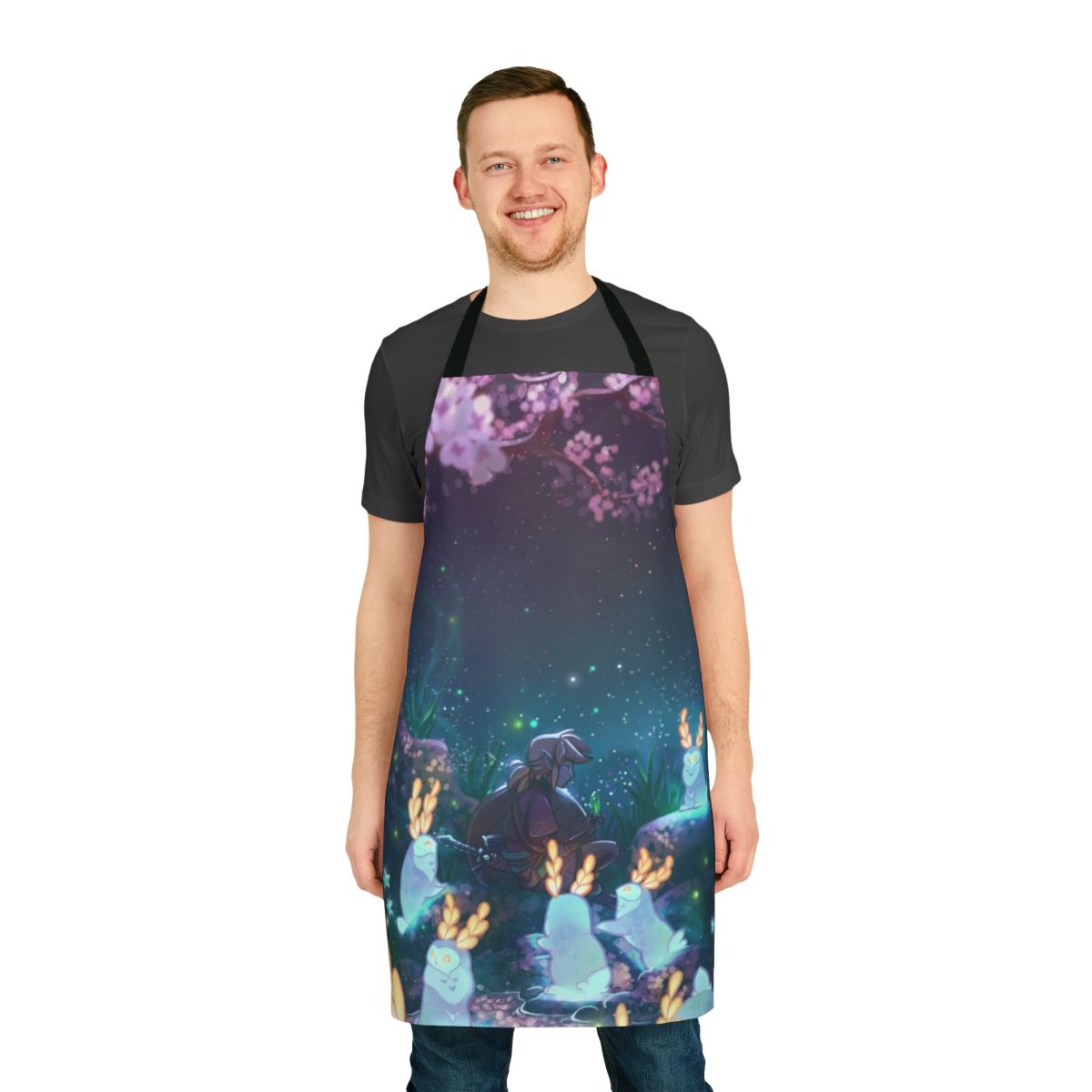 Whimsical apron featuring blupees, the moon, and a blossoming cherry tree