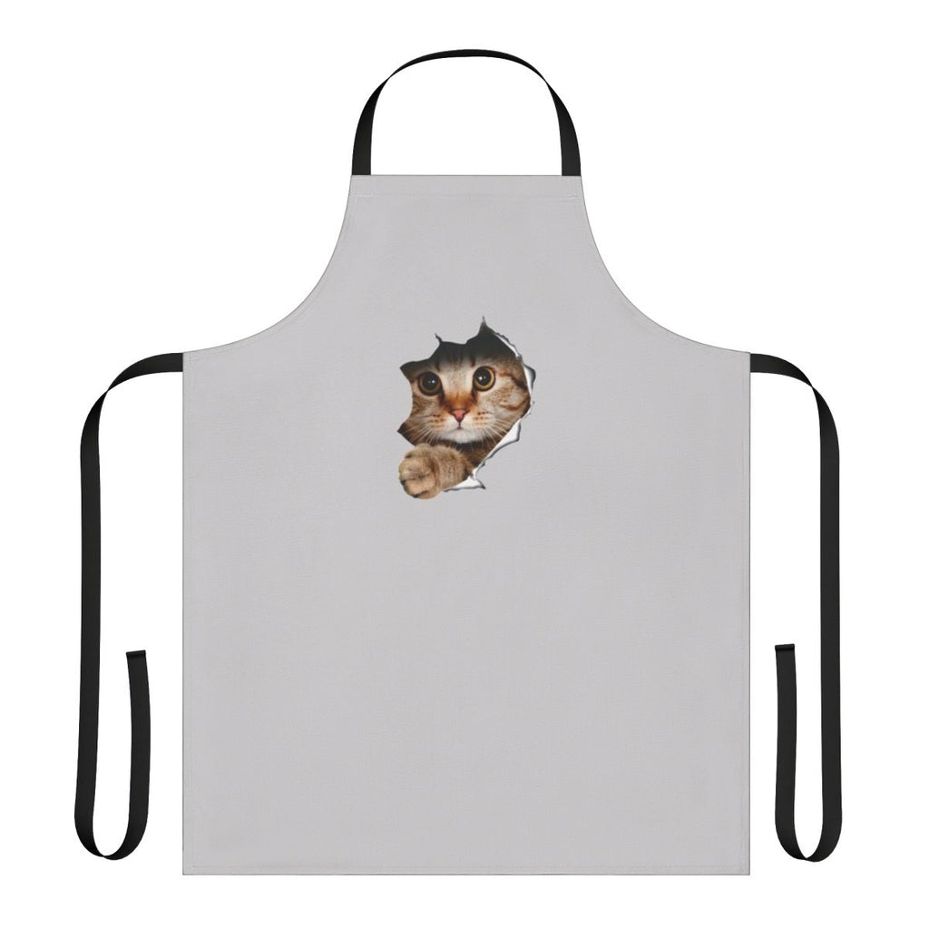 Whimsical apron with a mischievous cat peeking out from a ripped or torn paper/wall design