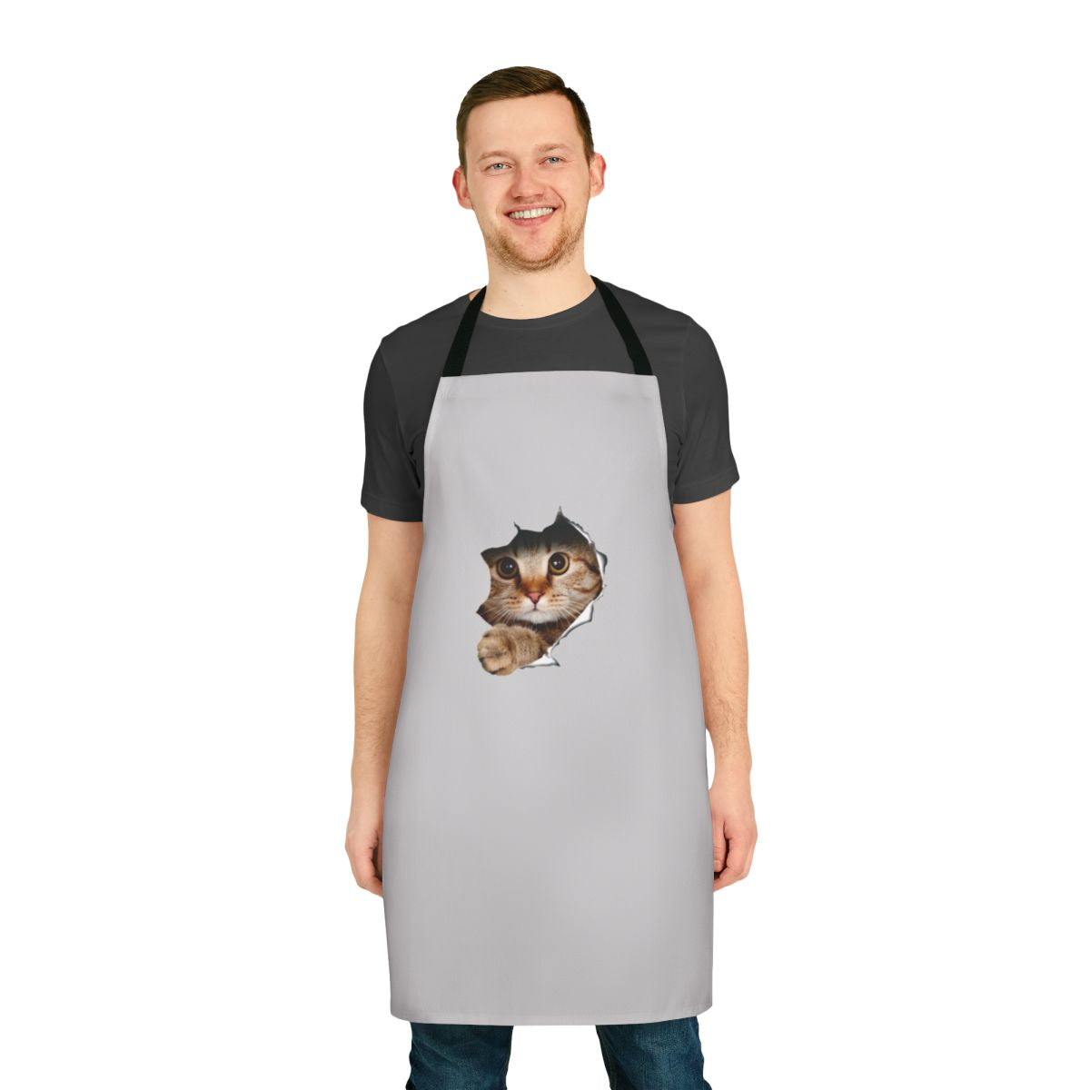 Whimsical apron with a mischievous cat peeking out from a ripped or torn paper/wall design