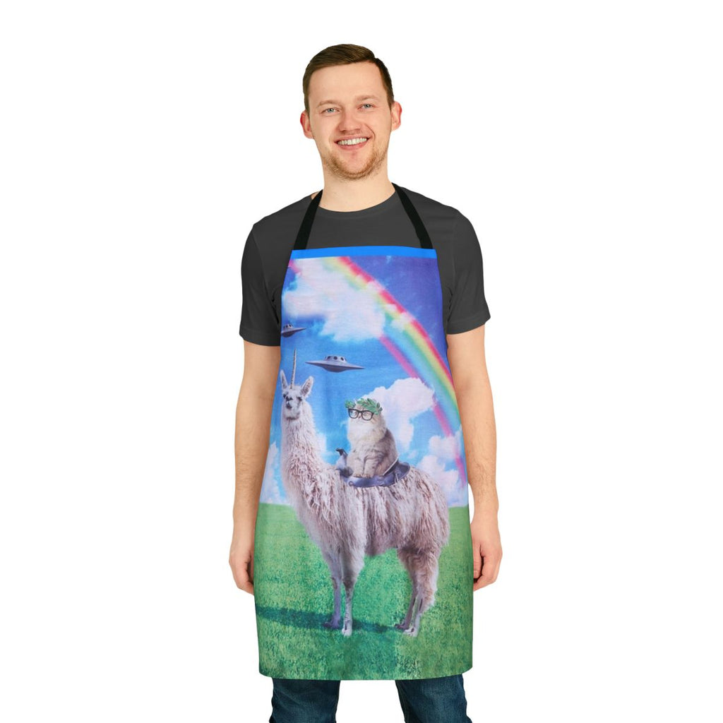 A whimsical apron featuring a cat riding a llama unicorn in a space-themed, rainbow-filled scene.