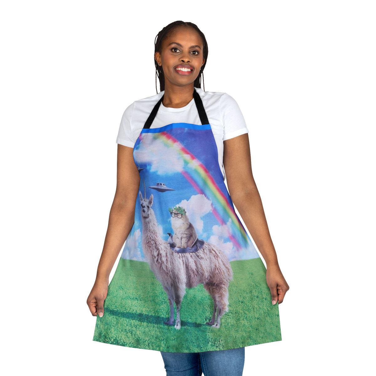 A whimsical apron featuring a cat riding a llama unicorn in a space-themed, rainbow-filled scene.