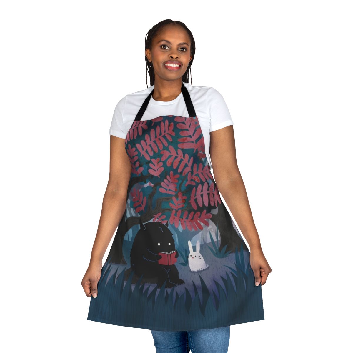 Apron featuring a watercolor design of forest friends, including a monster, bunny, and other woodland creatures, perfect for bookish nature lovers.