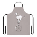 A charming apron featuring a goat riding a unicycle, a quirky and unusual design.