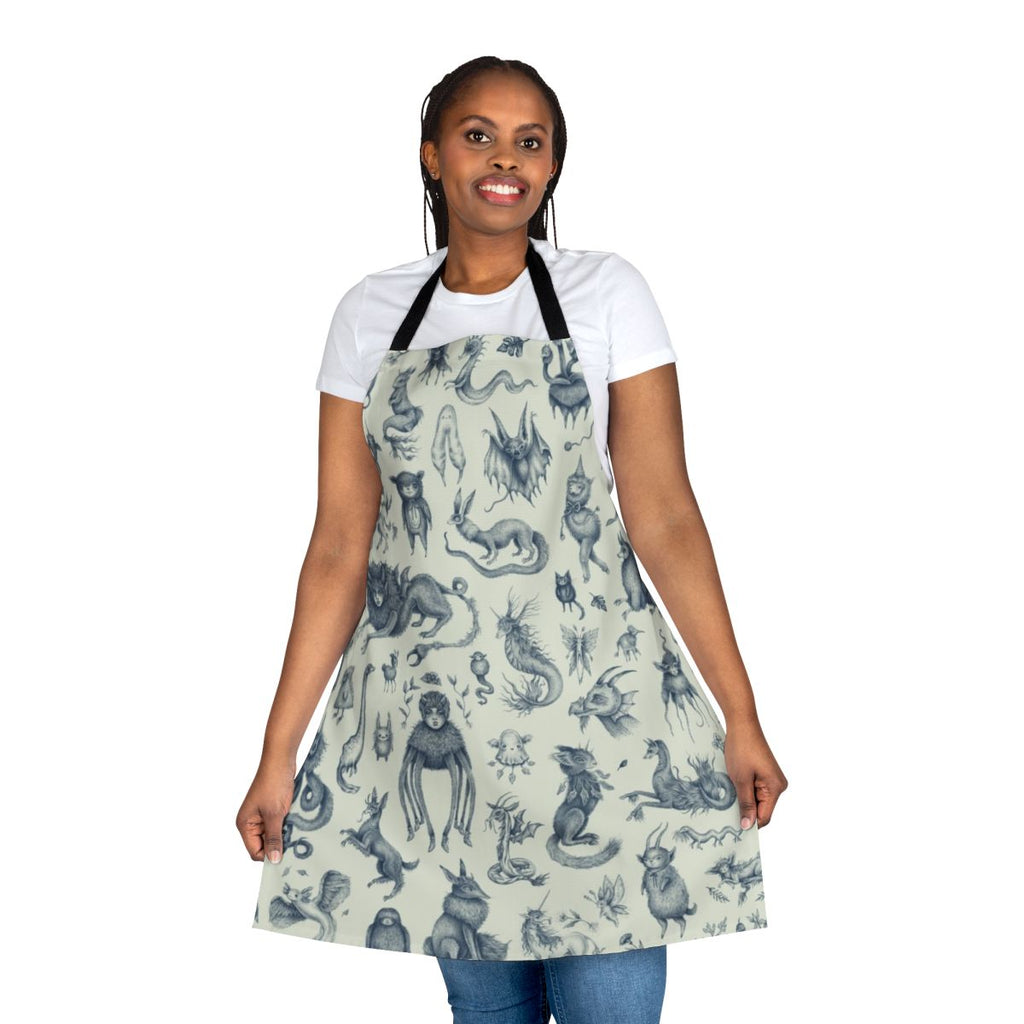 Apron featuring a pastel pattern with various magical and mythological creatures like Bigfoot, Loch Ness Monster, and dragons.