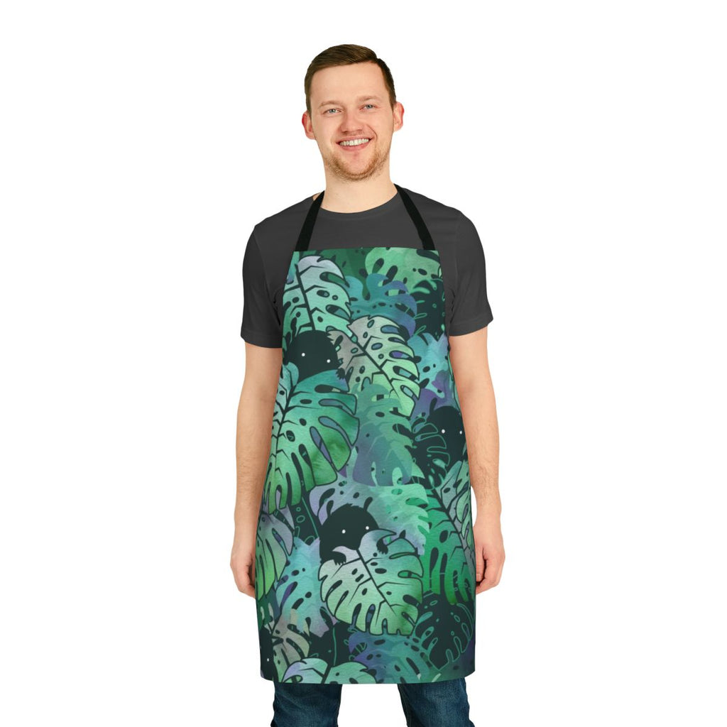 Colorful monstera leaf pattern printed on a white apron