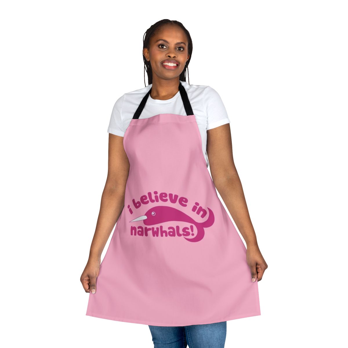 A pink apron with a cute narwhal design, perfect for the narwhal lover in your life
