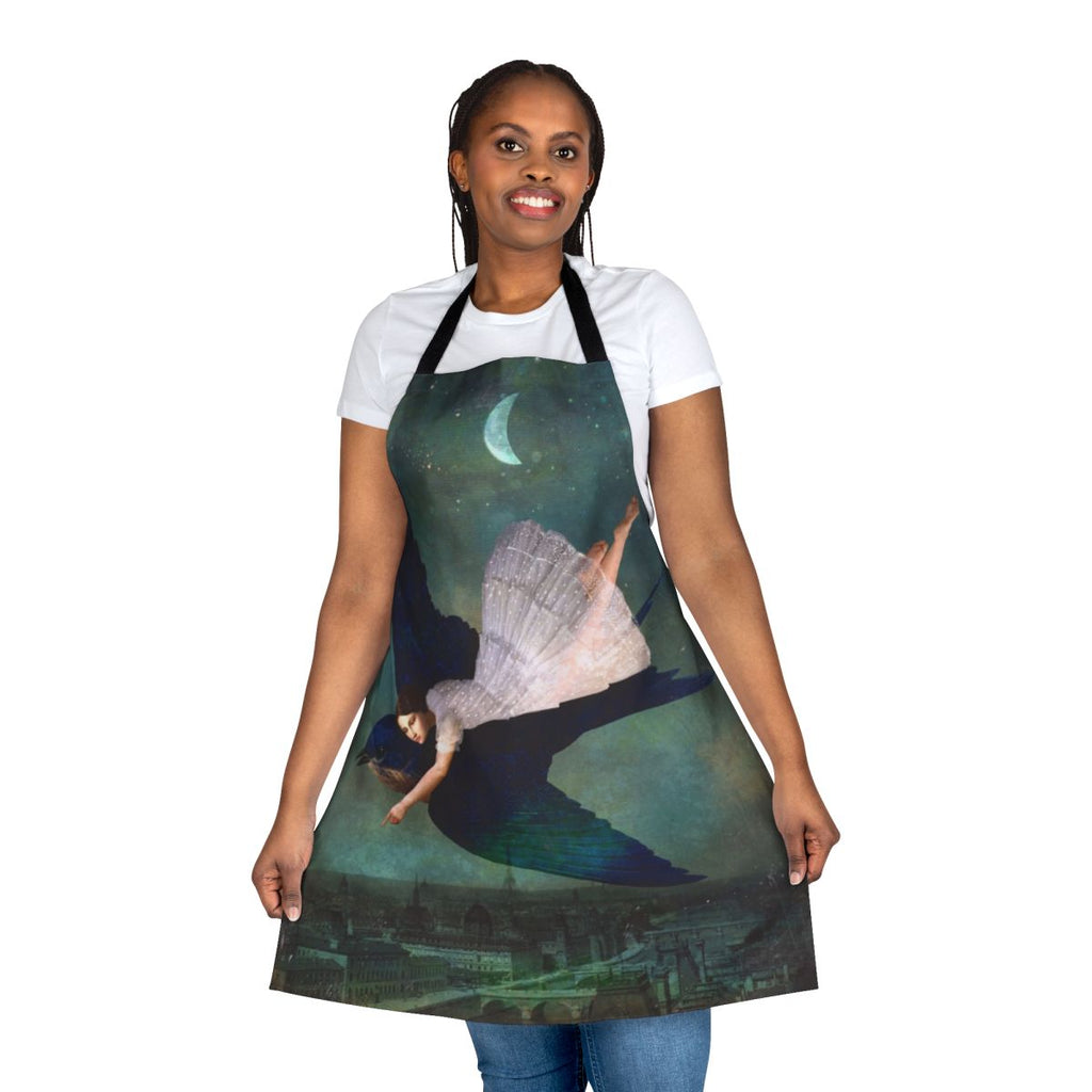 A whimsical apron featuring a surreal, fantasy-inspired design with a Paris skyline, moon, and stars