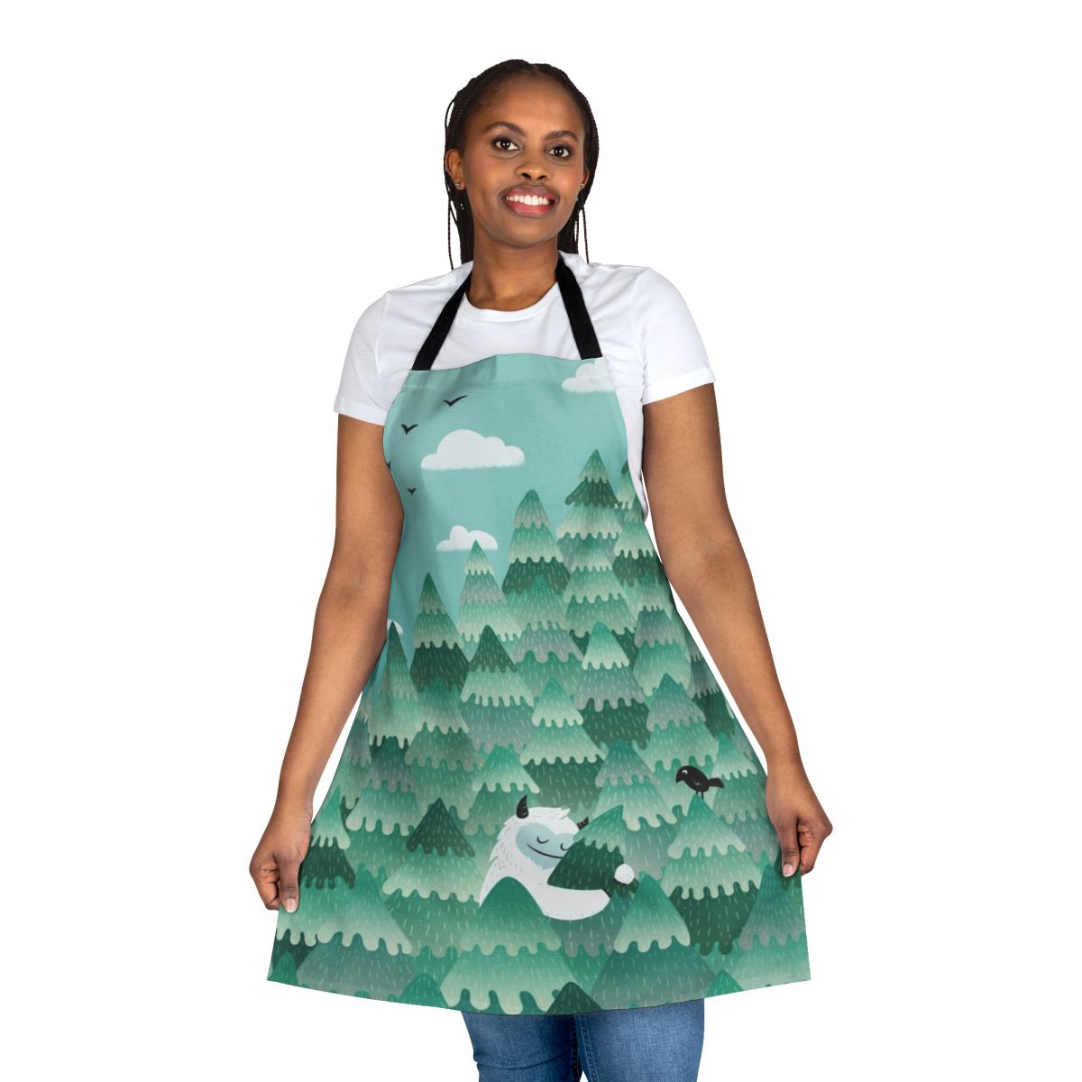 A colorful apron design featuring a forest monster or Bigfoot-like creature embracing a tree in a spring or summer forest scene.