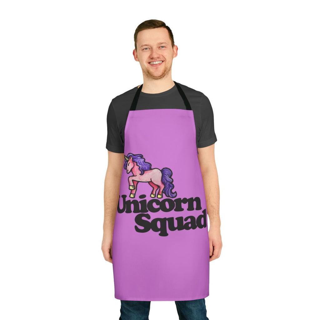 A pink and white unicorn-themed apron with an enchanting design