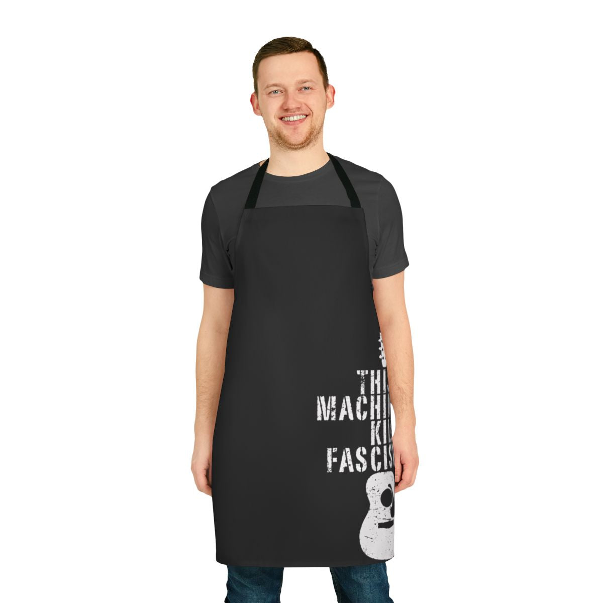 Woody Guthrie inspired anti-fascist apron with text "This Machine Doesn't Kill Fascists"