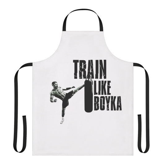 Person wearing a black apron with the text "Train Like Boyka" printed on it