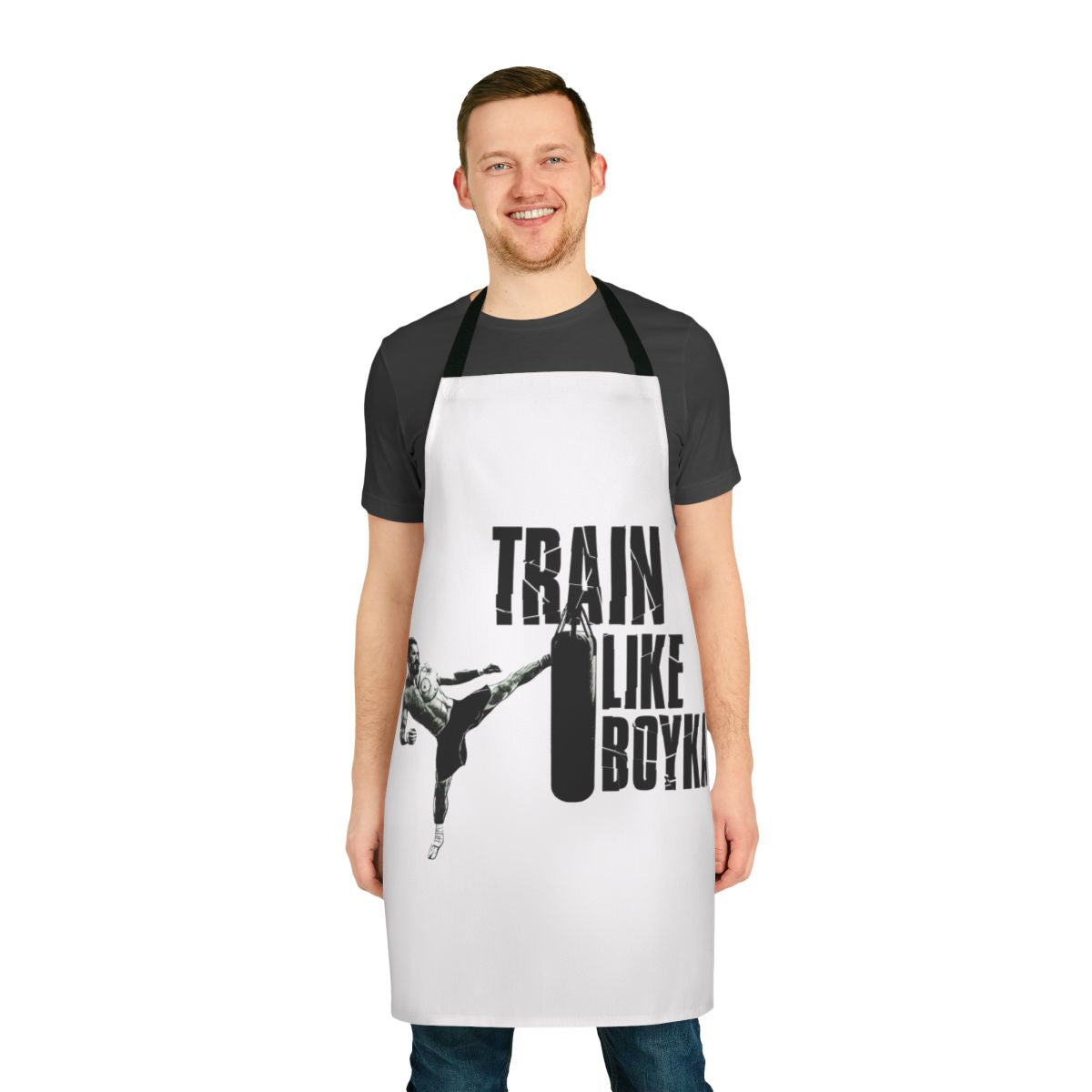 Person wearing a black apron with the text "Train Like Boyka" printed on it