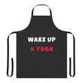 A colorful apron with yoga-inspired graphics and "Wake Up And Yoga" text.