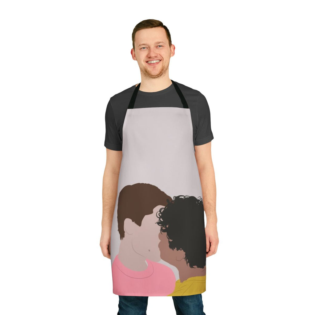 A white apron with a line art design of Prince Wilhelm and Simon Eriksson from the Netflix series Young Royals, kissing.